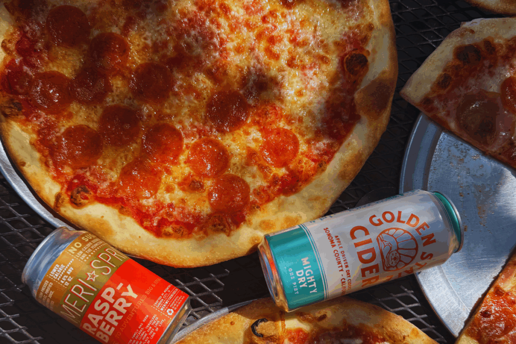 NYC style pizza Boise|Wiseguy Pizza Pie|authentic New York pizza Idaho|hand tossed stone deck oven pizza|best pizza Boise|golden crust pizza|Boise pizza by the slice|rich pizza sauce