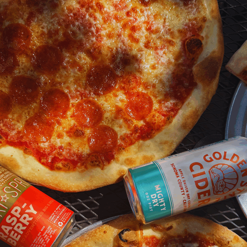 NYC style pizza Boise|Wiseguy Pizza Pie|authentic New York pizza Idaho|hand tossed stone deck oven pizza|best pizza Boise|golden crust pizza|Boise pizza by the slice|rich pizza sauce