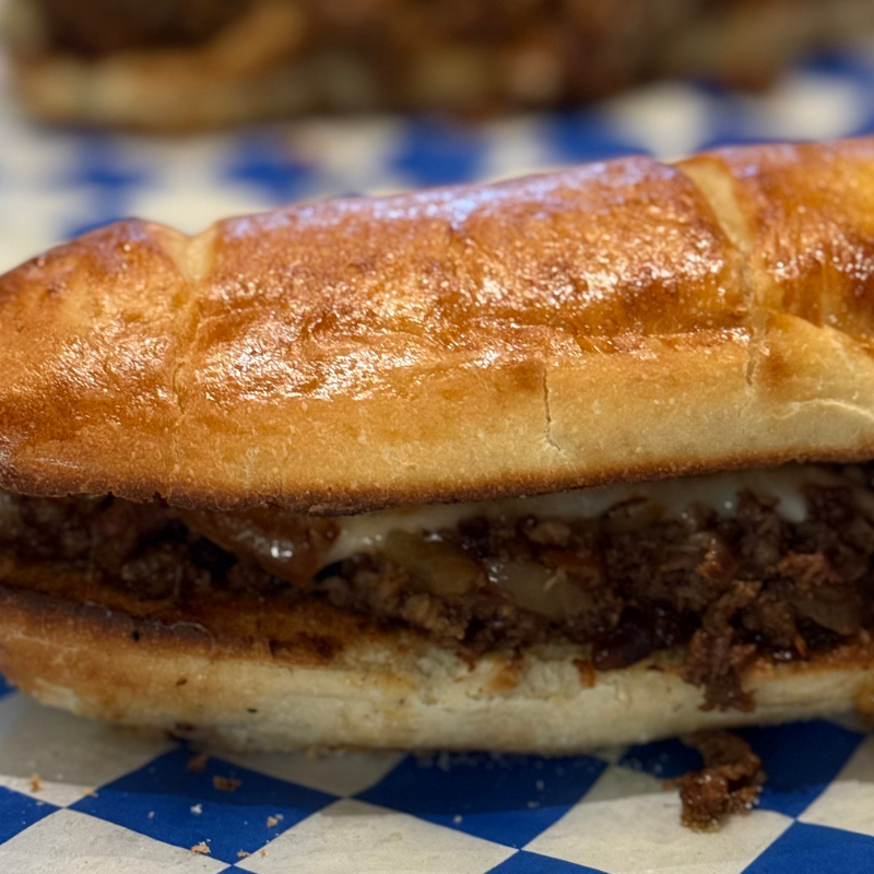 melty cheese pizza | stacked pizza toppings | Wiseguy Pizza Pie Boise | mouthwatering pizza Idaho | irresistible pizza Boise | pizza crust perfection | best pizza Boise | pizza slices